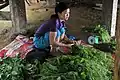 Weighing and preparing chayote shoots (Vietnam)
