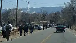 Walkers in front of the Holy Family church