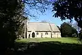 Church of the Holy Ascension, Melton Ross, Lincolnshire, 1867 by Ewan Christian, of stone with a bellcote and broad chancel apse[170]