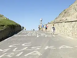 Photograph of a rising road leading to the summit of a mountain