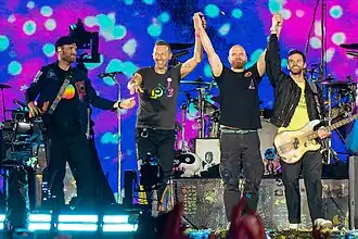 Coldplay preparing to bow on stage after performing