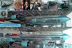 A metal-trussed hangar with a glass front and a shiny floor holds a large jet emblazoned with "United States of America" and other artifacts.