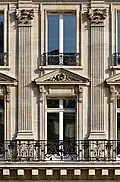 Colossal order of Composite pilasters. 1st and 2nd floors of a 19th-century building, 8 avenue de l'Opéra (Paris)