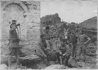 French soldiers drink at the village fountain in May 1916