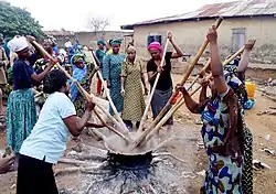 Group of women kneading amala