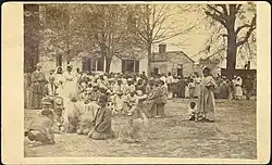 Contraband camp in Baton Rouge in "buildings formerly used as a Female Seminary"; this image, taken  1863 is ascribed to McPherson & Oliver (LSU Libraries item 13940009r)