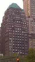 Court and Remsen Building, a high-rise clad in stone in a neoclassical architectural style, viewed from street level