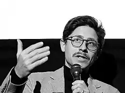 A photo of Daniele Rugo giving a talk in 2019