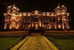 The building illuminated at night