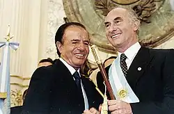 Outgoing President Carlos Menem with President–elect Fernando de la Rúa in 1999
