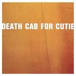 A close-up to a box with the words "Death Cab For Cutie".