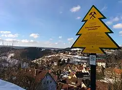 Yellow fir-tree shaped sign showing information about the railway's history
