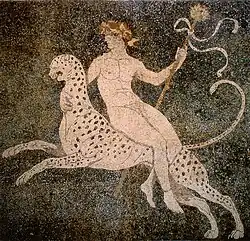 Dionysus, riding a cheetah and holding a thyrsus
