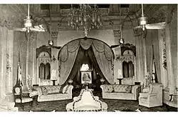 An old photo of the Wasif Manzil's drawing room with Nawab Wasif Ali Mirza Khan's picture at the back.