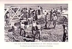 Preparing the foundations; watch tower being assembled on left; two Palestine Policemen in center.