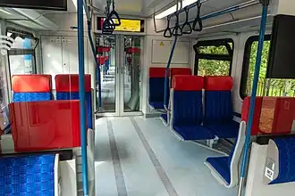 Passenger seats and gangway inside intermediate car of Ivolga-2.0.