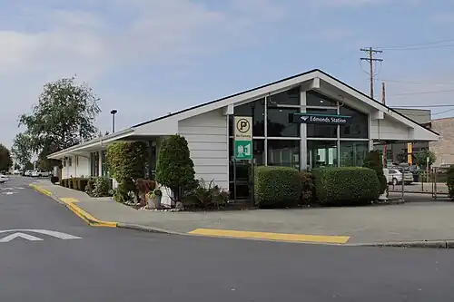 A building with a slanted roof and large windows