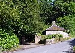 small lodge on road at entrance to Alltyrodyn