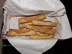 Thin waffles rolled into a cylindars