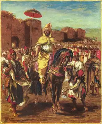 Mounted aristocrat before city walls wearing a hooded cape, surrounded by soldiers