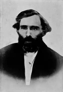 black-and-white photo of Eugene Skinner, a bearded man