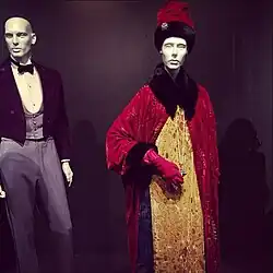 Shot of a FIDM Museum costume exhibit, highlighted by Gustave's signature uniform and Madame D's ornate coat-and-gown ensemble