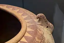 Falcon Horus, deity of Hierakonpolis, on a Naqada IIC jar, c. 3500 BCE, British Museum EA36328.[69][70]