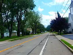 NY 249 east through the center of Farnham