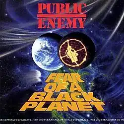 A charcoal-colored planet with Public Enemy's logo seen on it next to Earth in space. The album and group's name are also present.