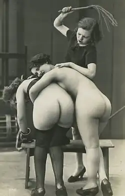 Two women being spanked by another