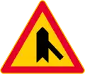 Junction with a minor road (formerly used )