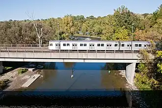 A T-1 crosses the bridge over the Humber River on its way west to Old Mill station