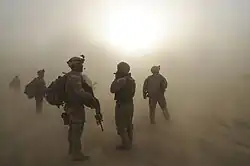 Soldiers of the 501st Infantry Regiment at Forward Operating Base Kushamond during a sandstorm.