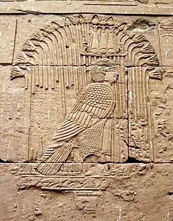 a relief of Mandulis, a god depicted with a hemhem crown