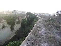 View along the forward ditch towards the left hand caponier in the distance.