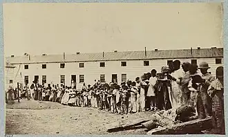 Photograph of children reading books at Freedman's Village, ca. 1864-1865