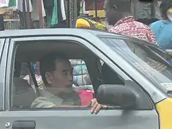Chinese taking taxi in Ghana