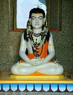 Sculpture of a young yogi sitting in the lotus position