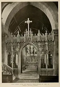 Rood screen, altar & reredos (1908–09), carved by Edward Maene.