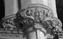 A medieval Green Man on the capital of a column in an English church in Lincolnshire