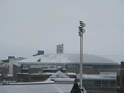 A large building in the center of a city skyline