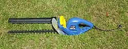 An electric hedge trimmer