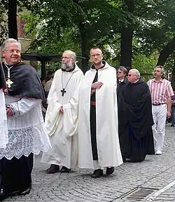 Procession of the Holy Blood in Bruges: abbott Van Hecke (second to the left) with one of his monks