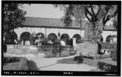 A photo of one of the fountains in Brand Park as well as the statue of Junípero Serra taken by Henry F. Withey in March 1936.
