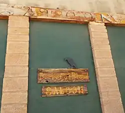 Boarded up Bucket of Blood Saloon with sign