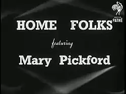 Black and white film still showing title card or scene