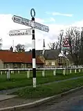 Signpost near School in centre of Hovingham