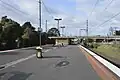 Southbound view from Platform 1 looking at station building further up the platform, June 2014