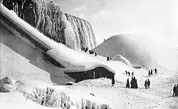 Tourists on the ice at the base of the American Falls, 1891