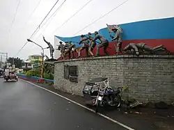 The Battle of Imus monument at the southern end of the bridge.